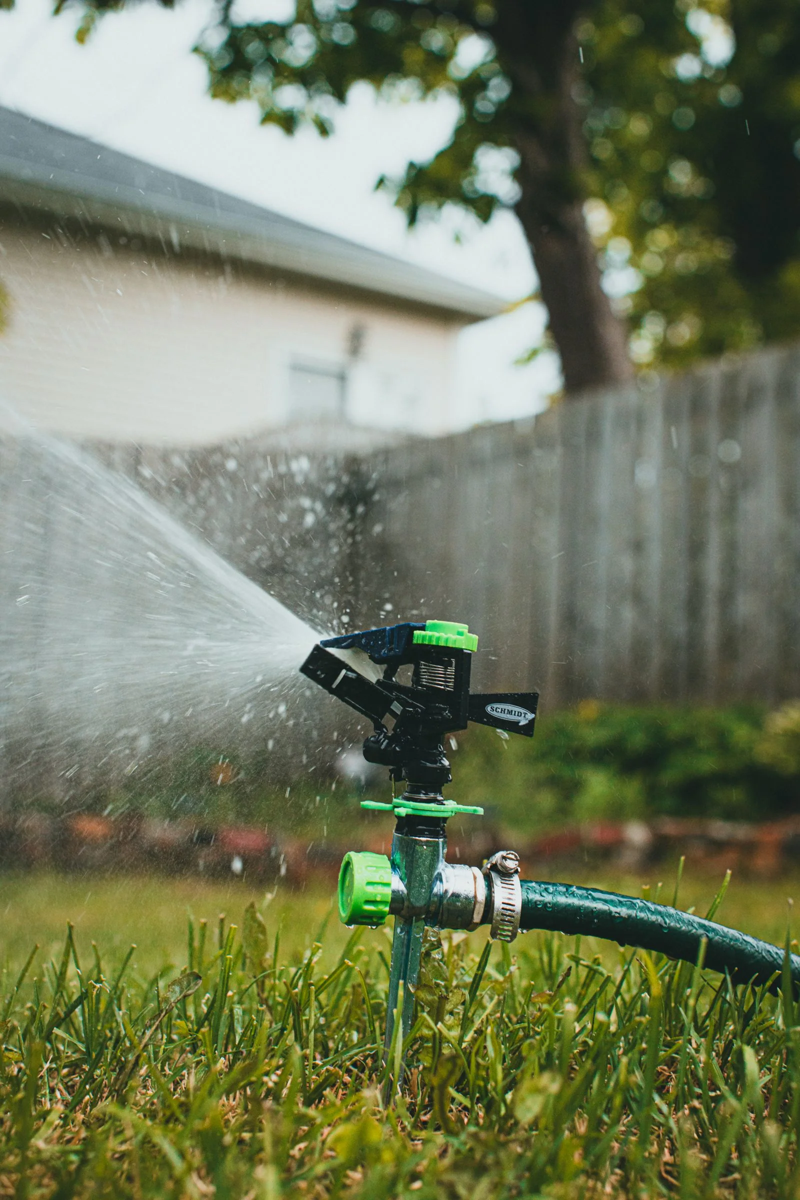 Garden irrigation sprinklers watering a lawn